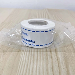 Detail of white kitchen labels on a roll for food dating and contents identification