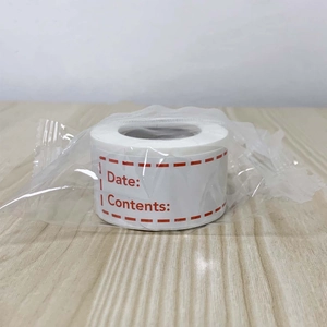 Close-up of food storage label roll with red border and date fields for kitchen organizing