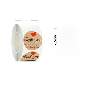 Detail of round kraft thank you stickers with red hearts on a 500-label bulk roll