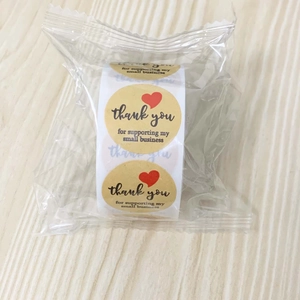 Macro shot of 1.5 inch kraft paper thank you stickers for small business packaging