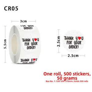 Detail showing 500 pack of 2.5cm round Thank You stickers with a red heart on roll