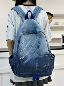 Gradient blue denim backpack with multi-pocket design for students shown from the back