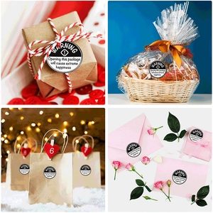 Black round WARNING extreme happiness gift labels shown on various gift packaging types