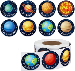 Detailed view of solar system space stickers with inspirational quotes on a product roll