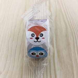 Detailed view of colorful cartoon animal reward stickers roll in transparent packaging