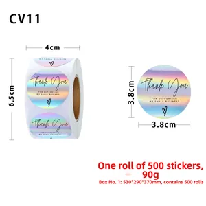 Macro detail of rainbow holographic Thank You stickers on roll with heart icon labels