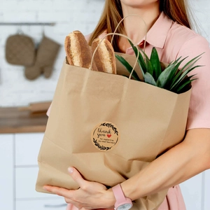 Kraft paper thank you sticker for supporting small business on a bread paper bag