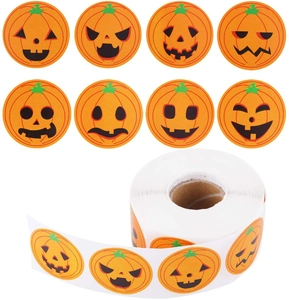 Macro detail of 8 different pumpkin face stickers on a roll for Halloween decoration