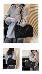 Close-up of minimalist black oversized bowling bag with slim dual straps for commute