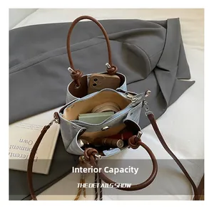 Top-down view of the blue denim bucket bag interior showing spacious compartments and storage