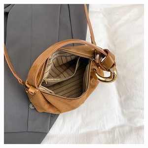 Top view of brown matte leather Boston bag showing striped lining and inner gold zipper