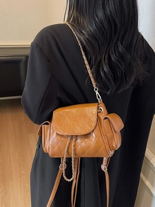 Quilted caramel leather bag with chain strap shown on model for daily commute style