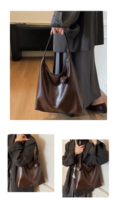 Detail of dark brown leather tote bag with elegant shoulder strap knot and brand logo