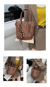 Detail of leopard print bucket bag with wood bead tassel and brown leather handle