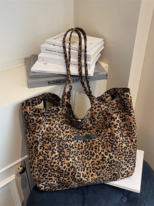 Large vintage leopard print tote bag with long shoulder straps and front pocket