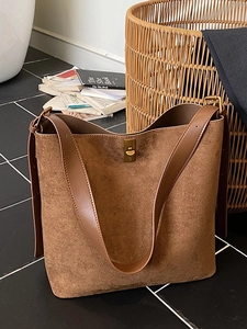 Brown leopard-textured suede tote bag with bronze metal clasp and leather strap