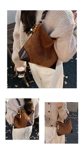 Detail of vintage matte suede hobo bag with dark leather corners and wooden bead charm