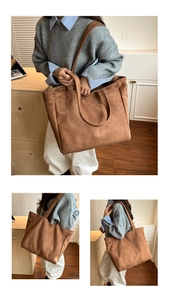 Detail view of large brown suede tote bag with wide strap and spacious interior design