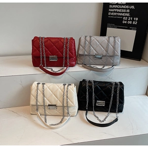 Detailed display of four quilted chain bags in red, gray, cream, and black colors