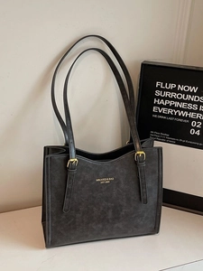 Vintage dark grey tote bag with marble texture and gold hardware on white surface
