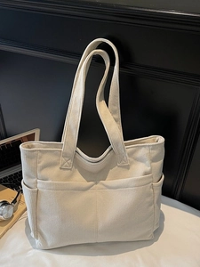 Sac fourre-tout minimaliste en velours côtelé beige avec poches pour mode quotidienne