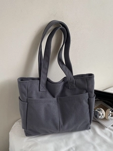 Grand sac cabas en velours côtelé gris foncé avec plusieurs poches pour le travail