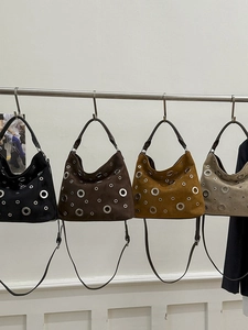 Suede hobo shoulder bags with metal eyelets in black, brown, yellow, and beige