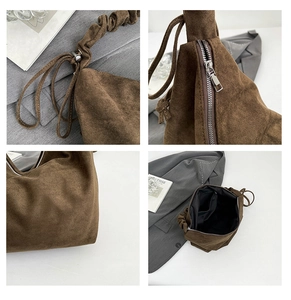 Detail view of brown leopard hobo bag with silver zipper and drawstring shoulder strap