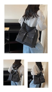 Detailed back view of a large black canvas messenger bag with utility cargo pockets