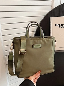 Olive green nylon tote bag with wide shoulder strap and Clear K metal logo plate