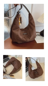 Brown faux suede hobo bag with leather strap and wooden beaded tassel charm detail