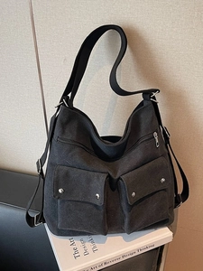 Black canvas large tote shoulder bag with dual exterior pockets and adjustable straps