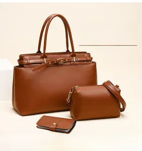 Three-piece amber brown leather set including tote bag, crossbody pouch and card holder