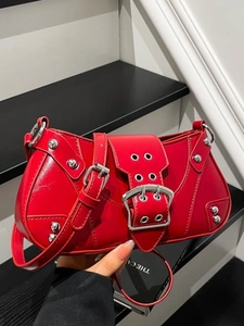 Chic red retro saddle bag with silver rivets and hardware for a Y2K fashion look