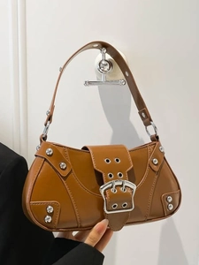 Retro saddle bag in caramel brown with silver rivets and metallic buckle closure