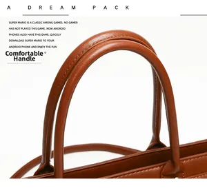 Close-up of comfortable reinforced brown leather handles on a large tote handbag