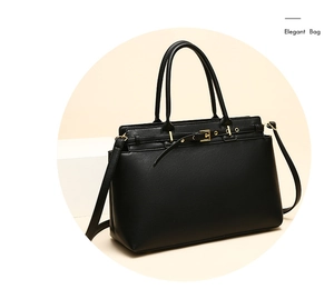 Detail showing high-quality black faux leather texture and gold buckle on a tote bag