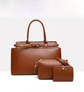 Detailed set of brown tote bag, crossbody bag, and small wallet with gold hardware