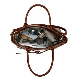 Classic brown tote handbag featuring a spacious interior for daily commute and essentials