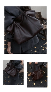 Gros plan sur un cabas vintage marron avec texture cuir et rivets sur les côtés