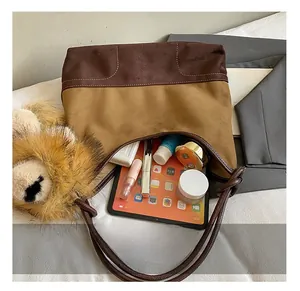 Detailed interior of contrast color tote bag showing large capacity for tablet and cosmetics