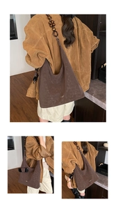 Detail of dark brown faux suede tote featuring unique wooden bead shoulder strap accents