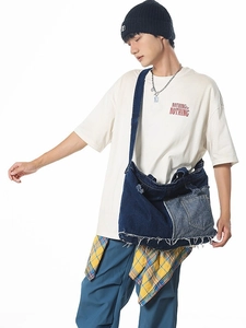 Retro denim patchwork shoulder bag with distressed frayed edges and a large capacity
