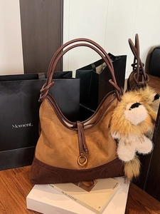 Brown suede hobo tote bag with plush lion charm for stylish autumn commuting women