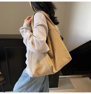 Side view of oversized khaki nylon tote bag showing its large capacity and drape