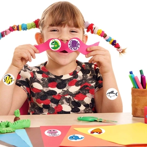 Roll of 500 cartoon sea animal reward stickers for kids featuring octopus and shark designs