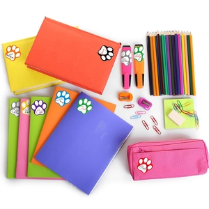 Customized colorful paw print name stickers on various school and office stationery