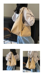 Vue détaillée du grand sac hobo kaki minimaliste avec bandoulière large sur l'épaule