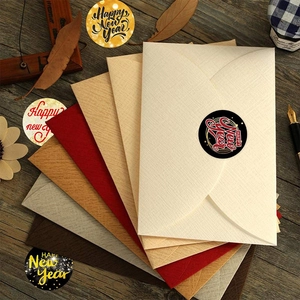 Assorted colorful textured New Year envelopes with Happy New Year sealing stickers