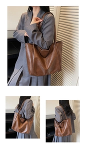 Close-up of a large dark brown PU leather tote bag showing smooth texture and twin straps